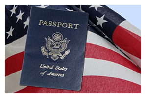 Photo of an older man's hand holding a passport with a airline ticket sticking out of it.